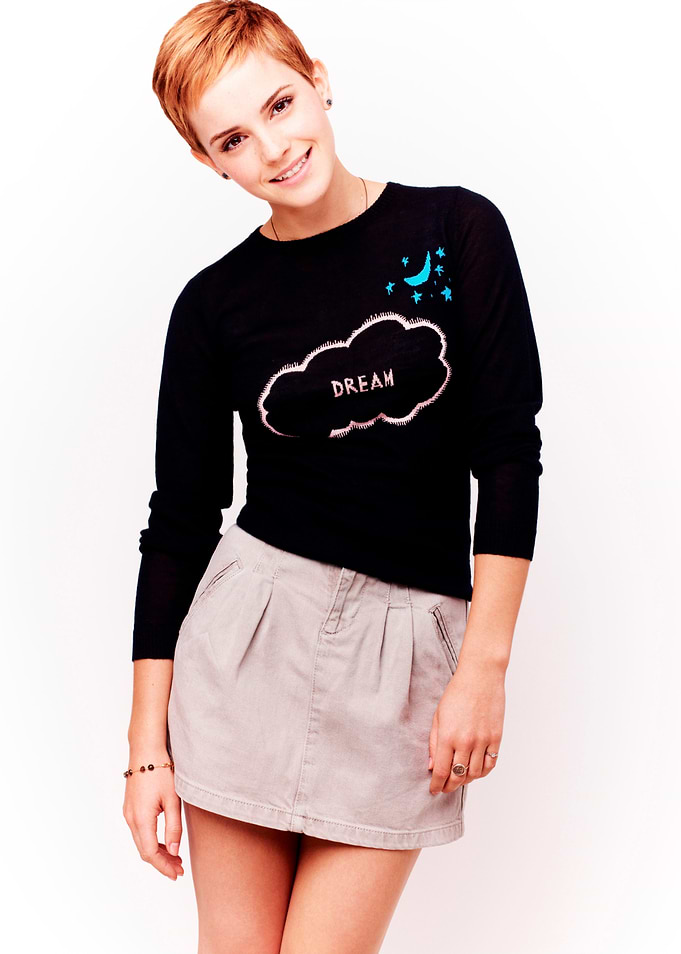 Emma Watson in a black sweater and skirt