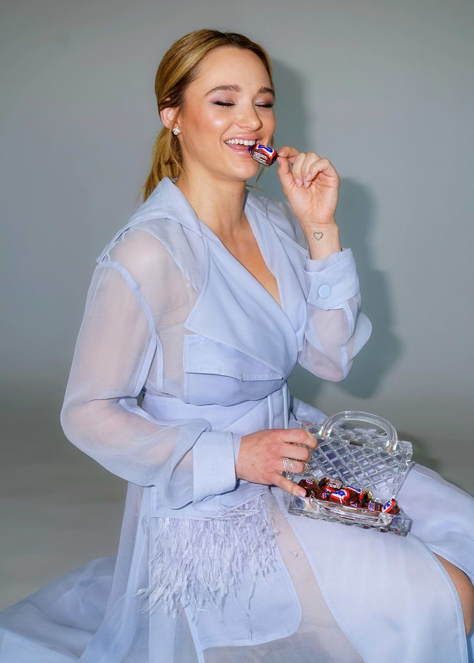 Hunter King eating candy from a purse