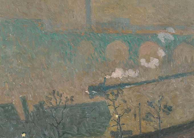 Train crossing a bridge in a misty landscape