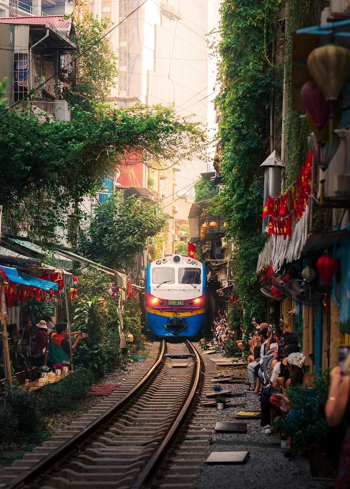 Train passing through a narrow street