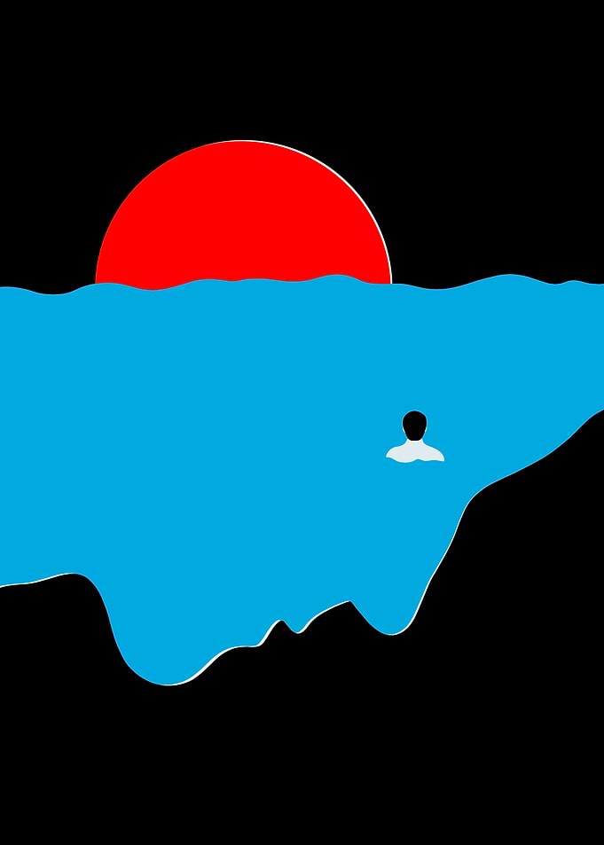 Person swimming at sunset