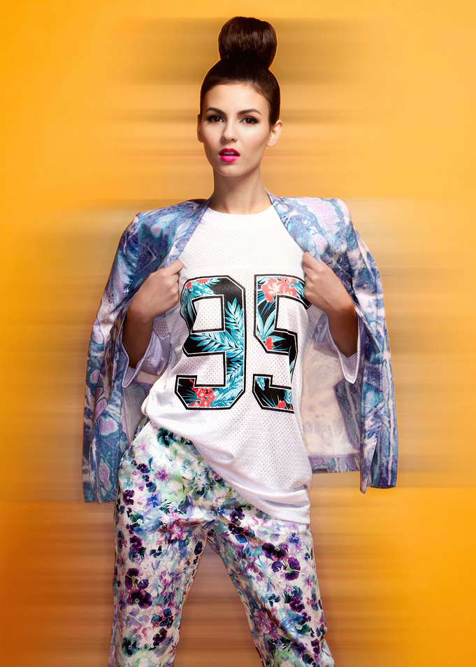 Victoria Justice in floral print outfit with '95' shirt