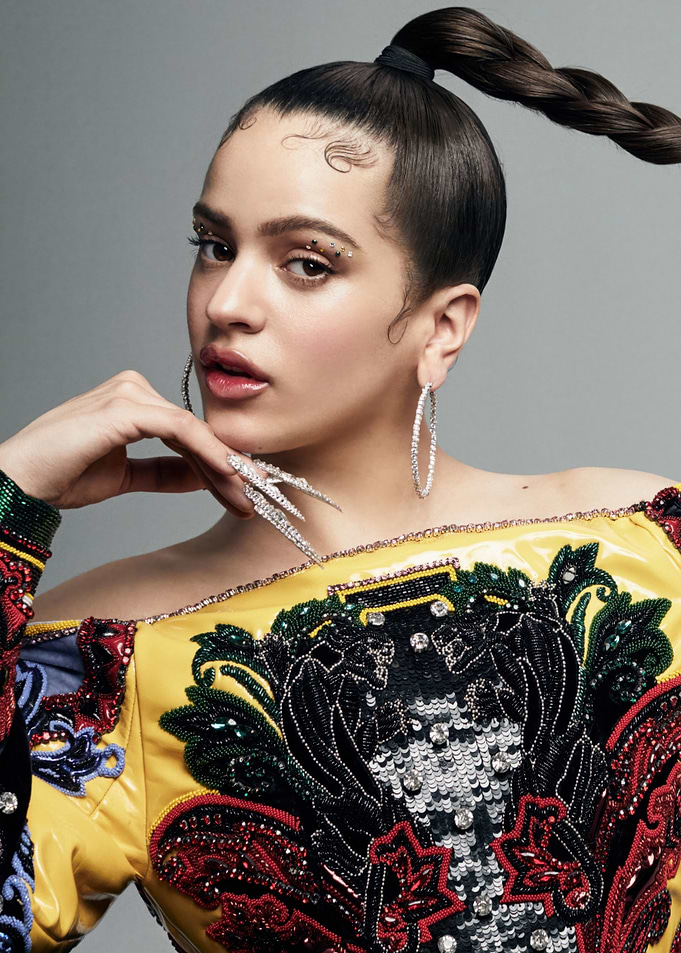 Rosalía with elaborate nails and makeup