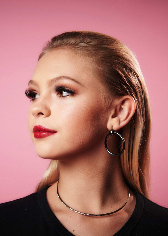 Jordyn Jones with Red Lipstick and Hoop Earrings