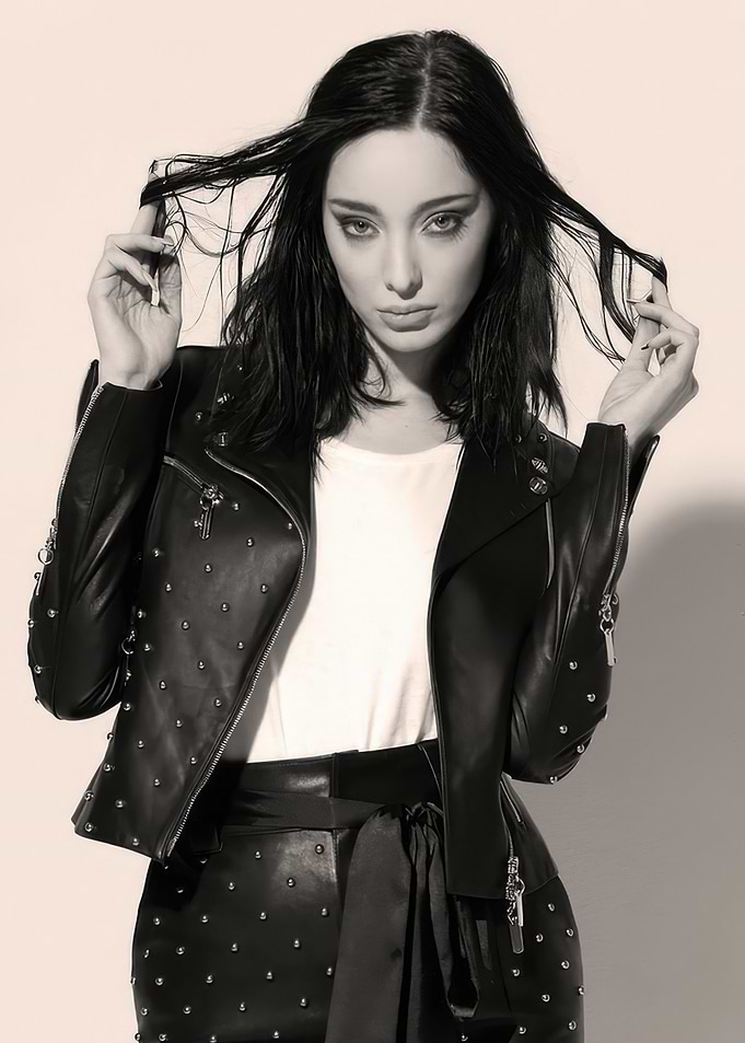 Emma Dumont in Studded Leather Jacket and Pants