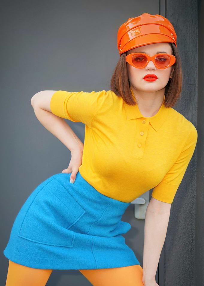 Joey King in bright fashion with orange accessories