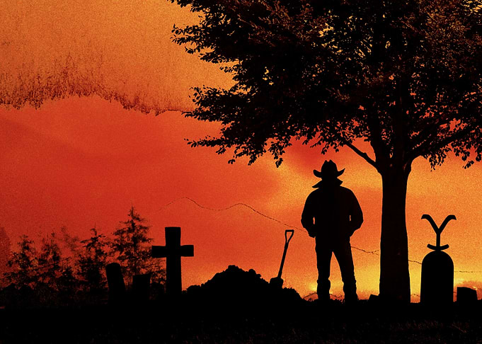 Cowboy at a Graveyard at Sunset