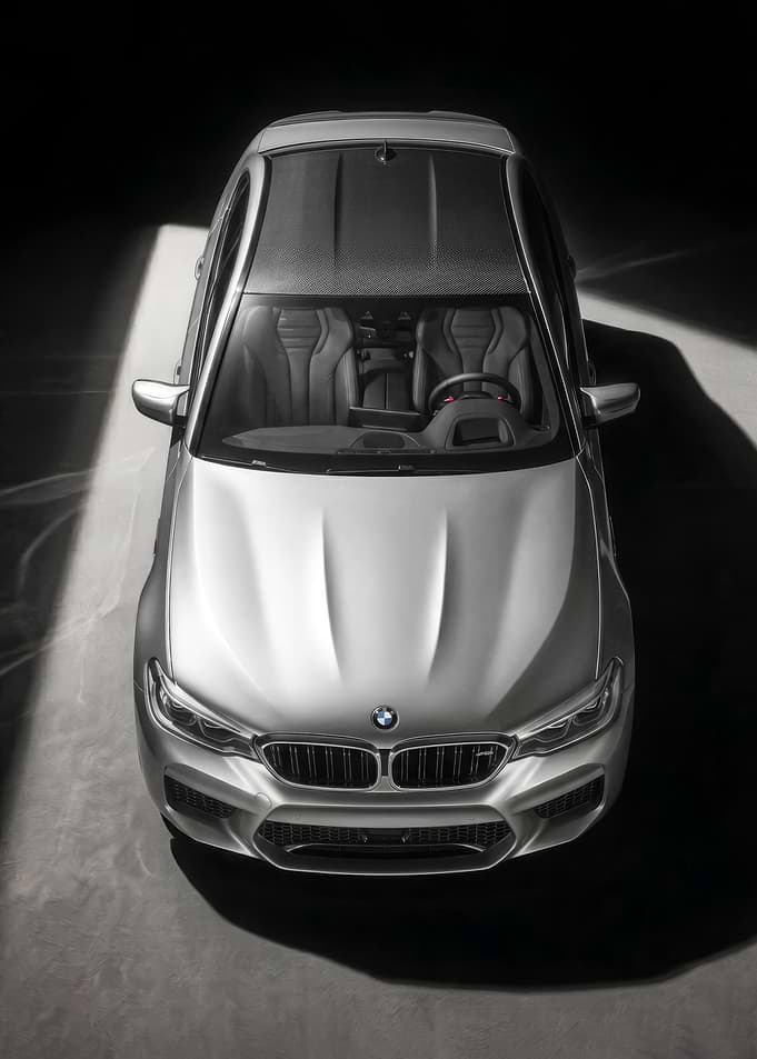 Top view of a silver BMW M5 f90