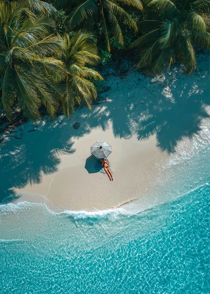 Woman relaxing on a tropical beach under an umbrella
