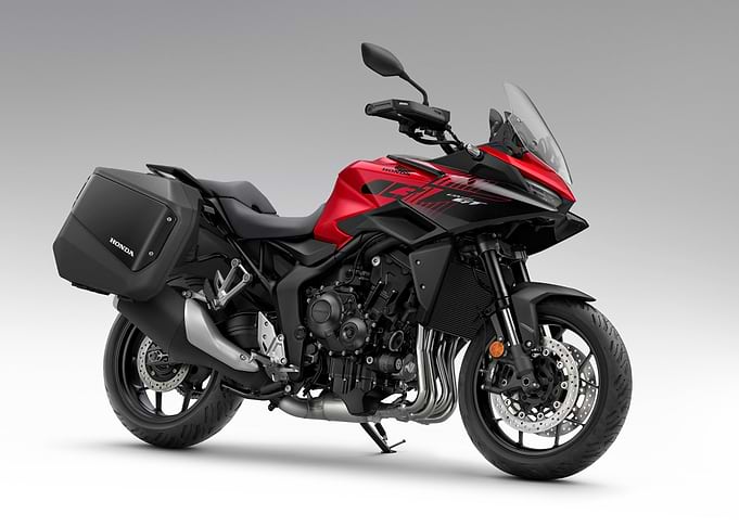 Red Honda motorcycle with saddlebags
