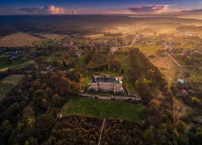 Aerial View of a Historic Castle at Sunrise