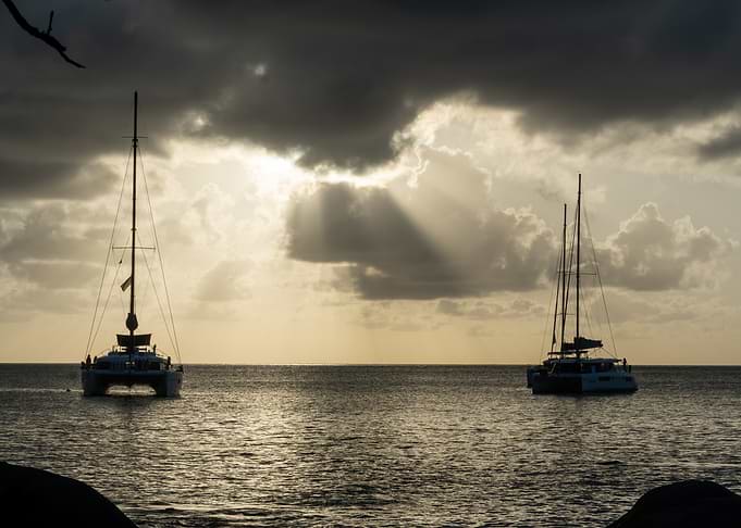 Catamarans at Sunset with Sunbeams