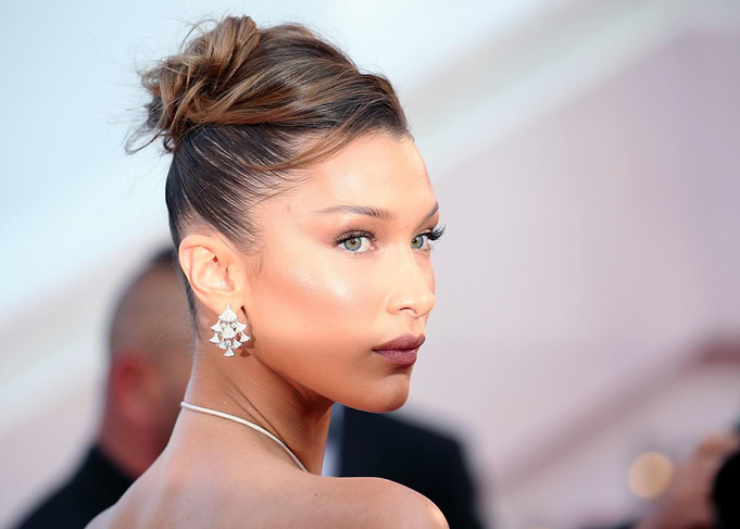 Bella Hadid wearing diamond earrings
