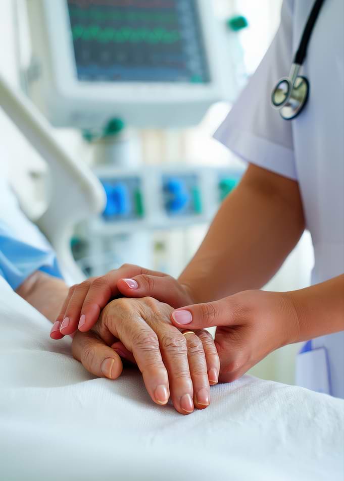 Nurse holding patient's hand