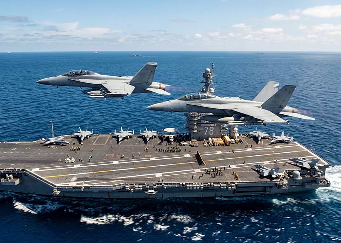 Fighter Jets Fly Over Aircraft Carrier