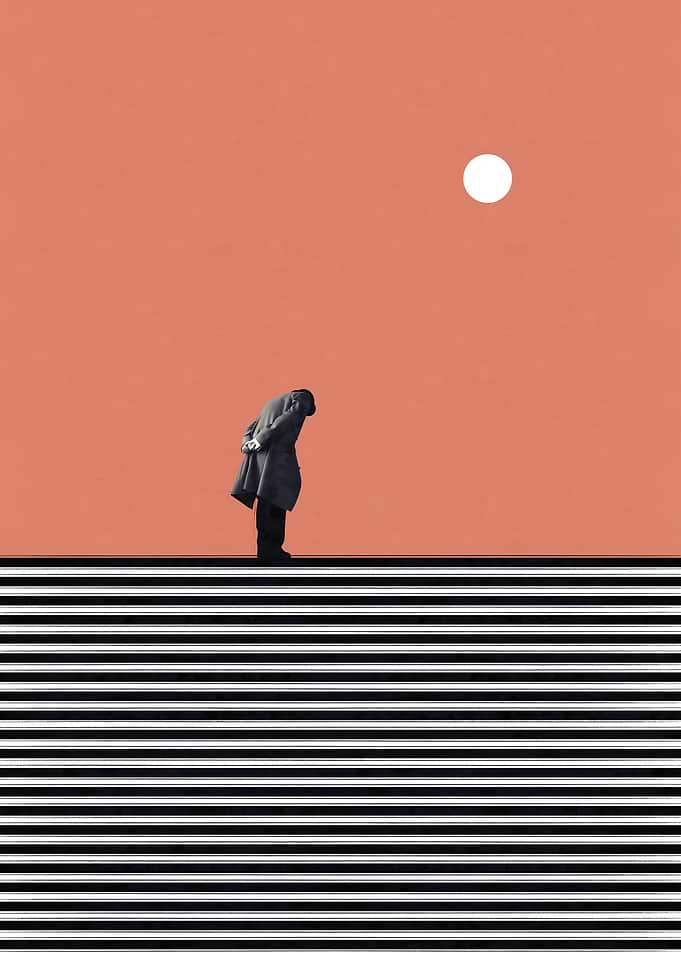 Man in coat looking down