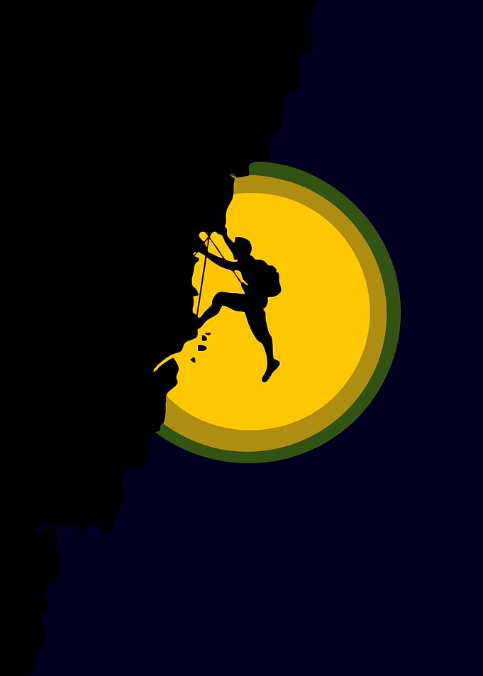 Silhouette of a climber against a sunset