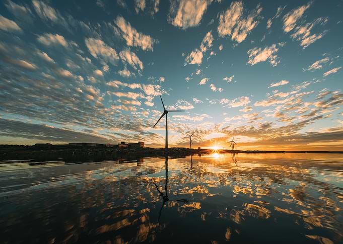 Wind Turbines Reflecting at Sunset