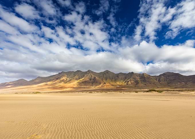 Desert landscape with mountains and clouds, Cofete Beach