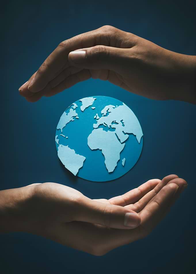 Hands protecting the Earth