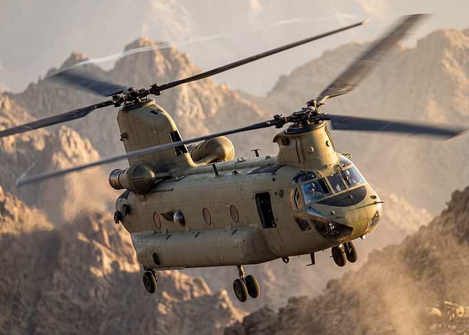 Chinook Helicopter Flying Over Mountains