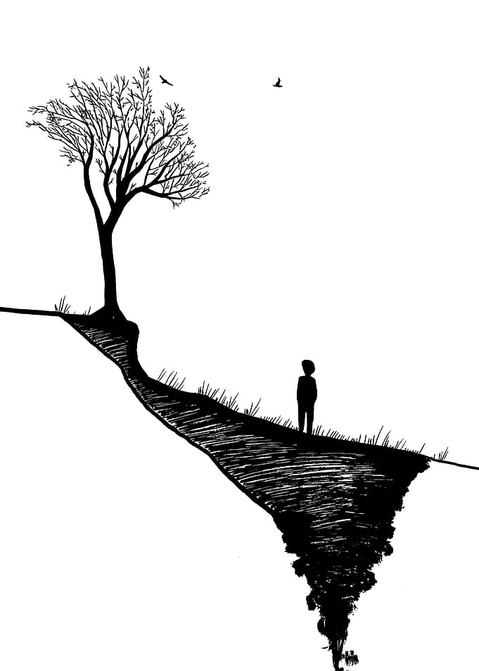 Lone figure on a cliff edge
