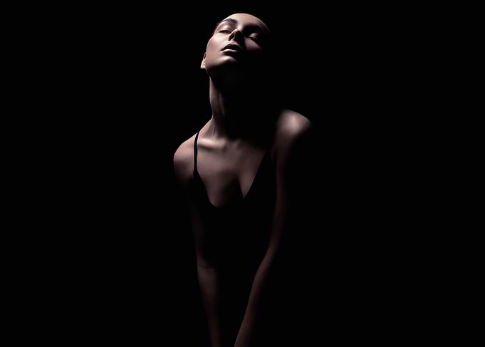 Woman in dramatic lighting