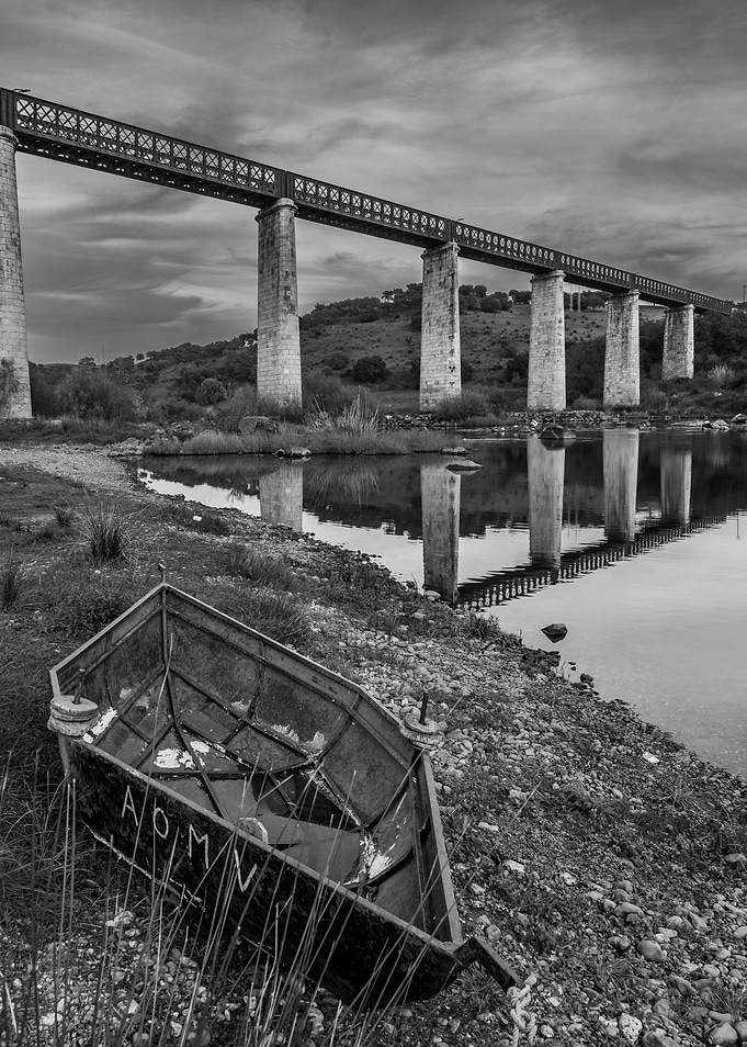 Old Boat Under a Railway Bridge