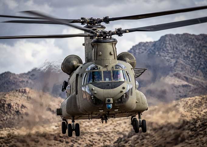 Military Helicopter in Desert Landscape