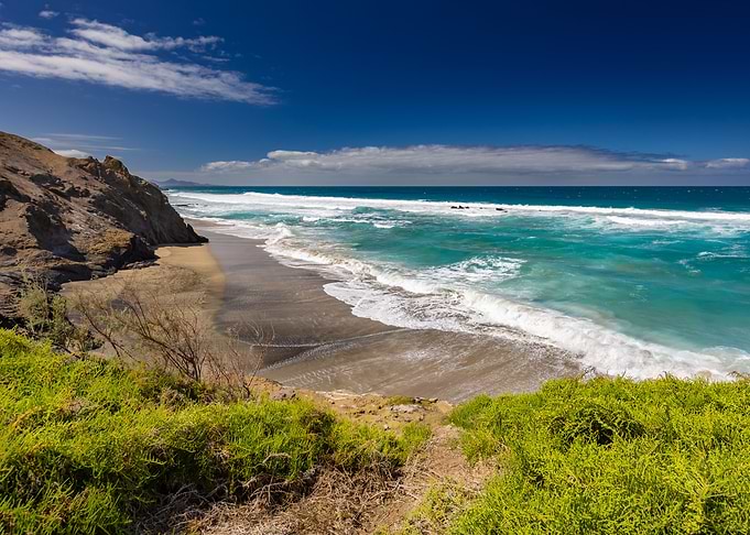 Rugged Coastline with Turquoise Ocean Waves