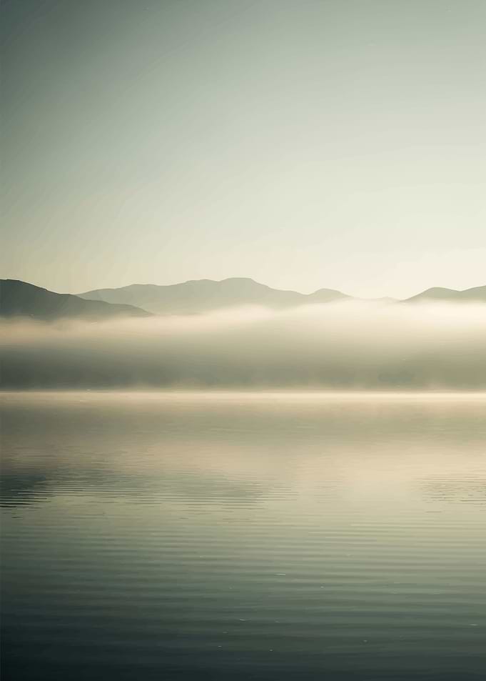 Misty Mountains Over Calm Lake