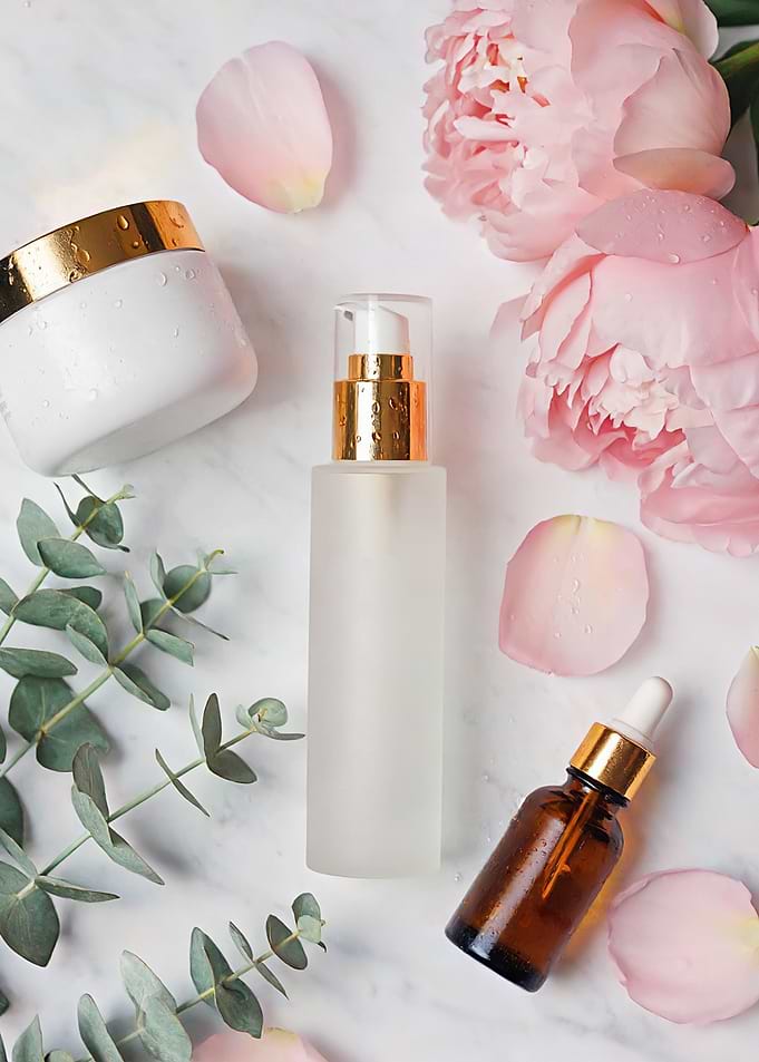 Skincare products with flowers and leaves