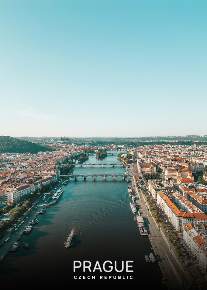 Prague Cityscape with River and Bridges