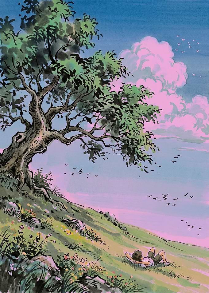 Boy relaxing under a tree
