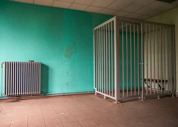 Abandoned Room with Cage and Radiator