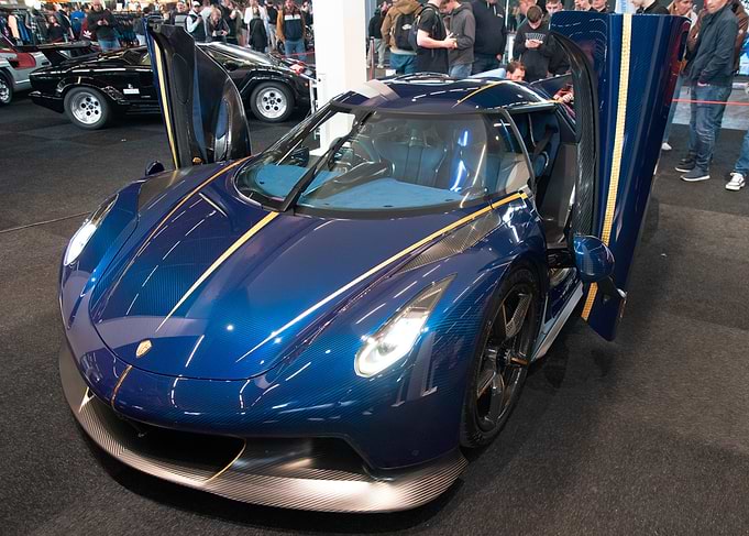 Blue Carbon Fiber Hypercar with Doors Open