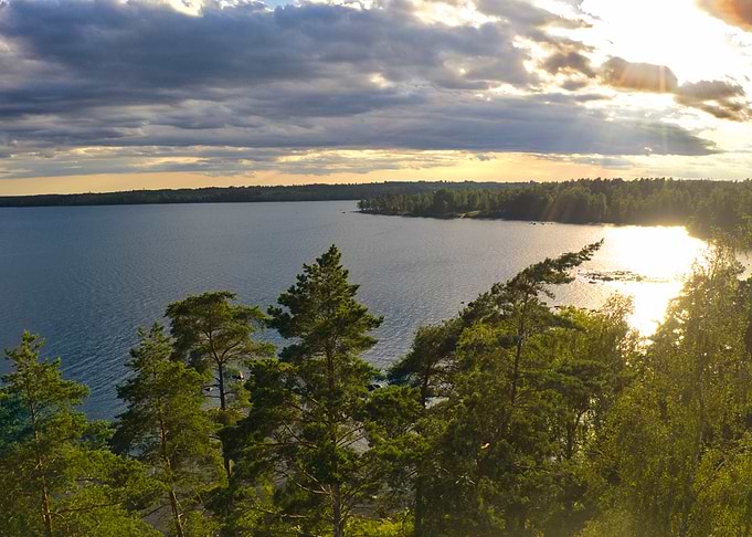 Sunset over a serene lake and forest