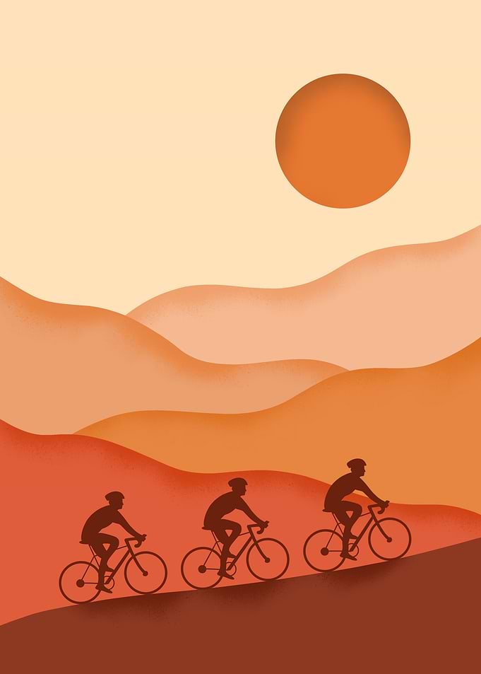 Cyclists riding at sunset