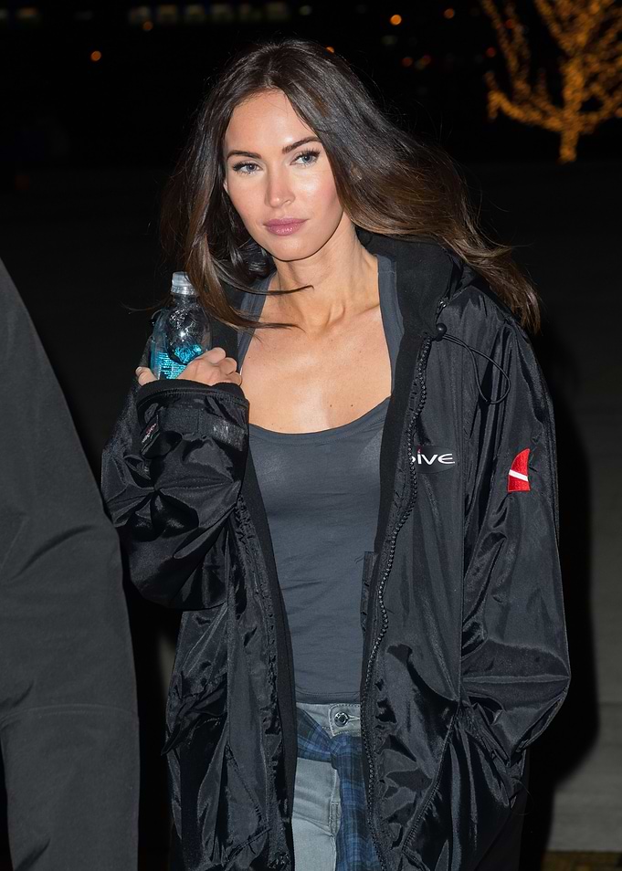 Megan Fox holding a water bottle