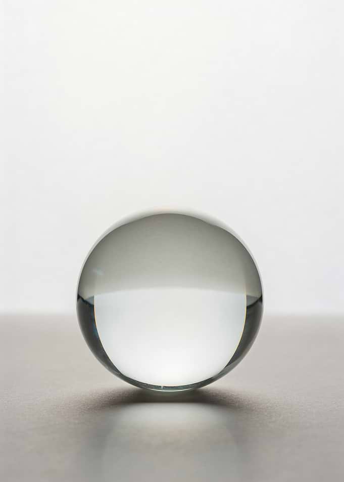 Clear Glass Sphere on Surface
