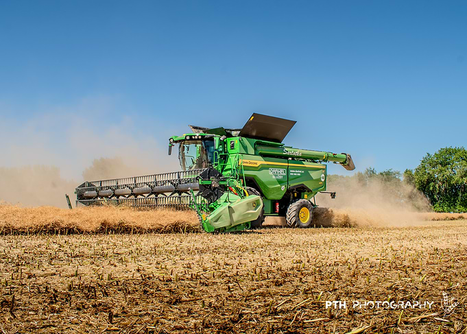 John Deere Combine Harvester in Field