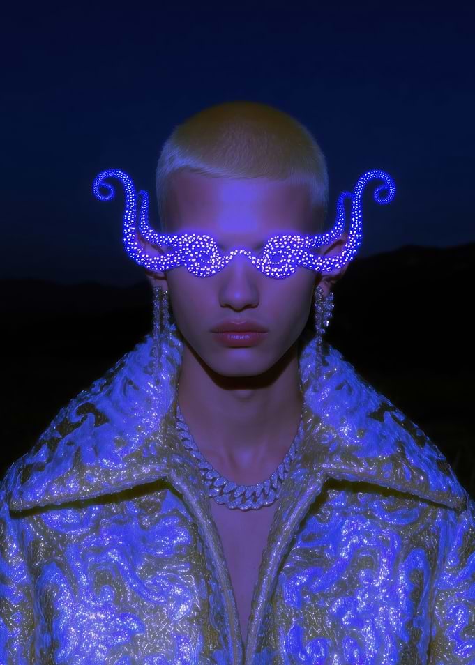 Avant-garde fashion portrait with glowing accessories