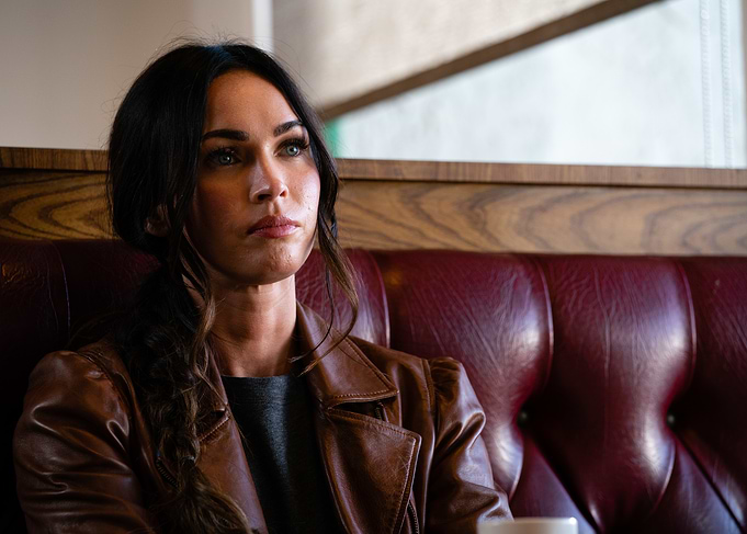 Megan Fox in a brown leather jacket