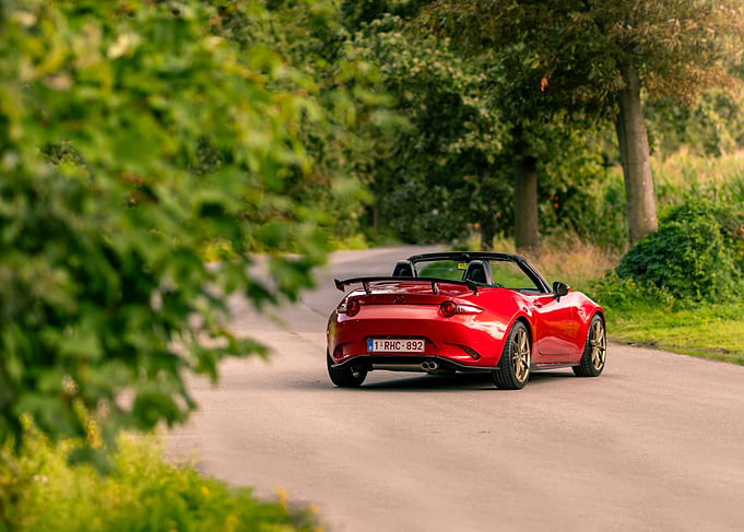 Red Mazda MX-5 on a Country Road