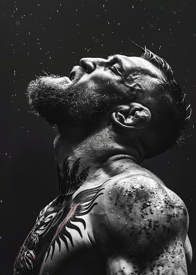 Man with tattoos in the rain