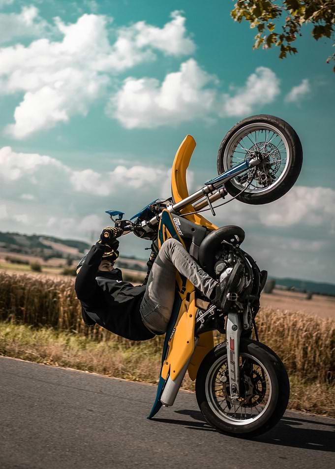 Motorcyclist performing a wheelie