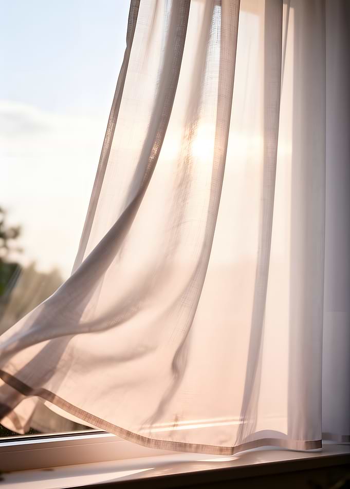 Sheer Curtain Blowing in the Wind at Sunset