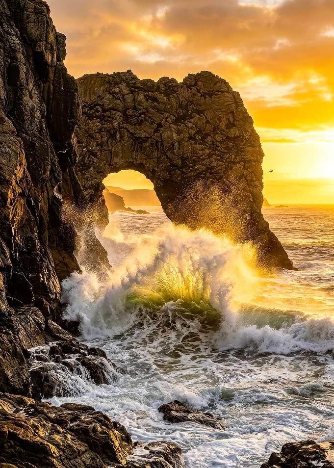 Dramatic Sunset Over Coastal Archway