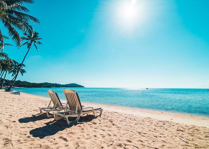 Tropical Beach with Lounge Chairs