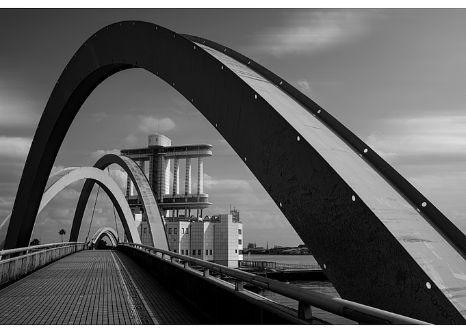 Modern Arched Bridge with Building